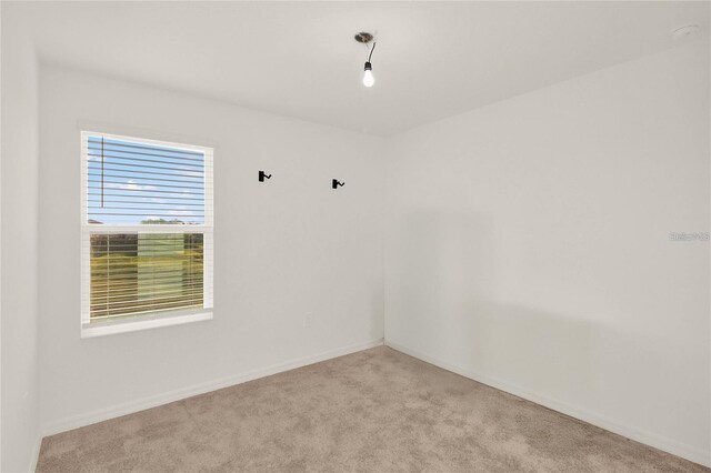 271 Inman Blvd, Winter Haven, FL 33881 - carpeted spare room with baseboards