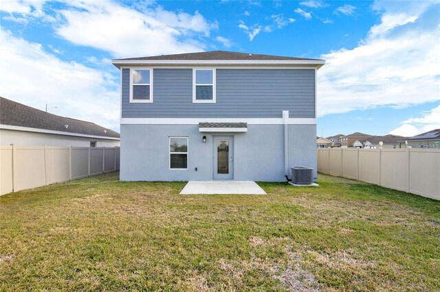 271 Inman Blvd, Winter Haven, FL 33881 - rear view of house with a patio area, central AC unit, and stucco siding