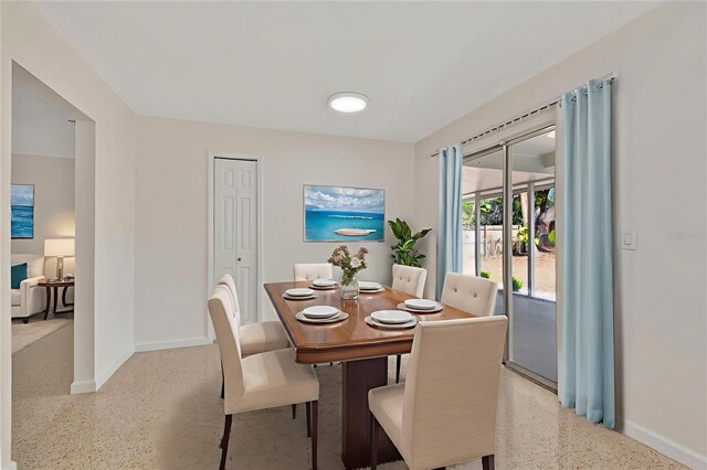 4714 W Vasconia St, Tampa, FL 33629 - dining area with dark aggregate flooring and baseboards