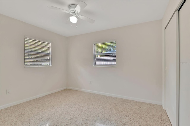 4714 W Vasconia St, Tampa, FL 33629 - unfurnished bedroom featuring a closet, speckle patterned floor, and a ceiling fan
