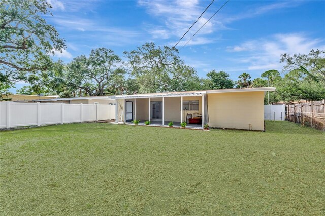 4714 W Vasconia St, Tampa, FL 33629 - rear view of house with a fenced backyard and stucco siding