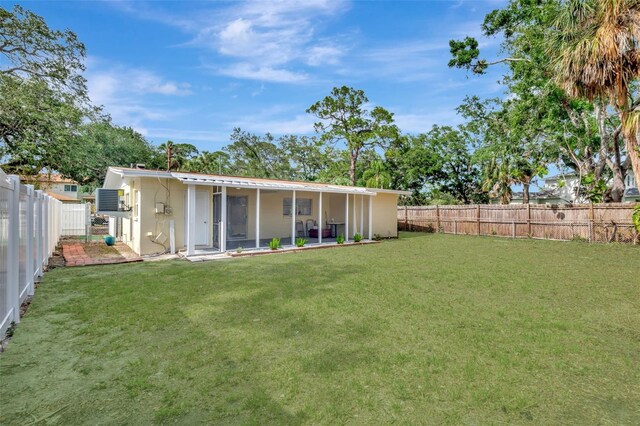 4714 W Vasconia St, Tampa, FL 33629 - back of property featuring a fenced backyard and a sunroom