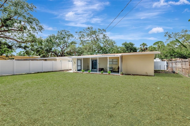 4714 W Vasconia St, Tampa, FL 33629 - back of house with a fenced backyard and a patio area