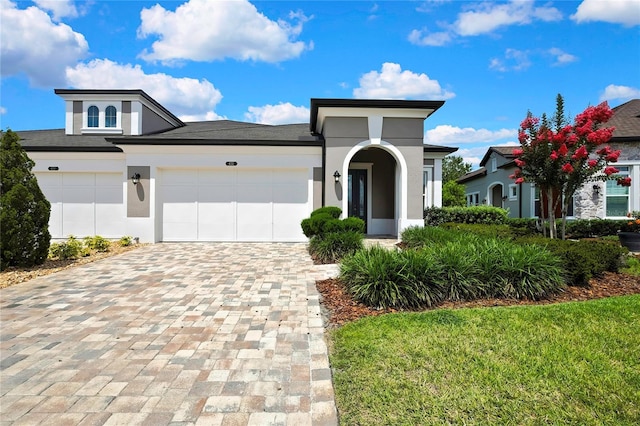 4155 Barletta Ct, Wesley Chapel, FL 33543 - view of front of property with decorative driveway, stucco siding, and an attached garage