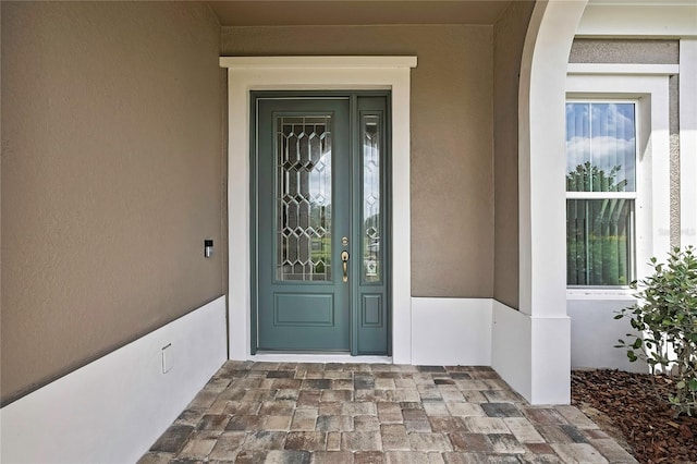 4155 Barletta Ct, Wesley Chapel, FL 33543 - view of exterior entry featuring stucco siding
