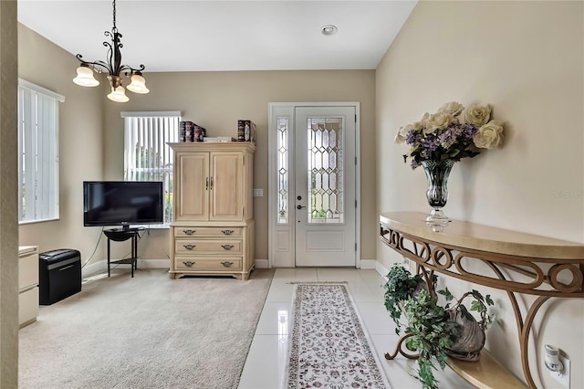 4155 Barletta Ct, Wesley Chapel, FL 33543 - entryway with a chandelier, baseboards, and light tile patterned floors
