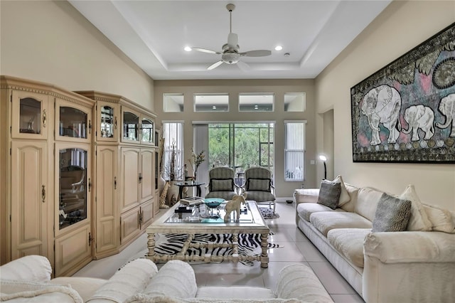 4155 Barletta Ct, Wesley Chapel, FL 33543 - living room with ceiling fan, light tile patterned floors, a tray ceiling, recessed lighting, and a towering ceiling
