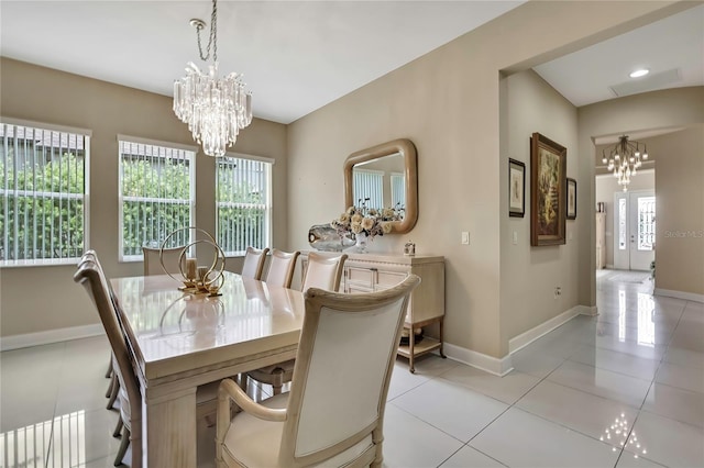 4155 Barletta Ct, Wesley Chapel, FL 33543 - dining space featuring a chandelier, plenty of natural light, baseboards, and light tile patterned flooring