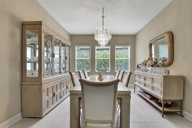 4155 Barletta Ct, Wesley Chapel, FL 33543 - dining room with a chandelier, baseboards, and light tile patterned floors