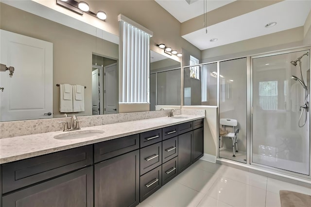 4155 Barletta Ct, Wesley Chapel, FL 33543 - full bath featuring a shower stall, double vanity, and tile patterned flooring
