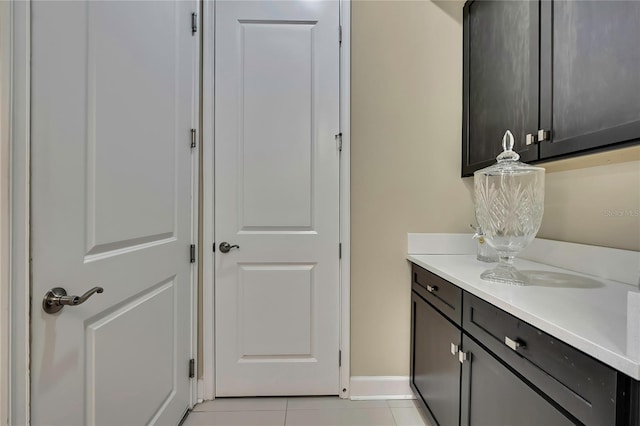 4155 Barletta Ct, Wesley Chapel, FL 33543 - laundry room with light tile patterned flooring and baseboards