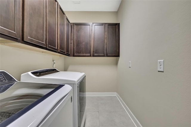 4155 Barletta Ct, Wesley Chapel, FL 33543 - laundry room featuring cabinet space, washer and dryer, baseboards, and light tile patterned floors