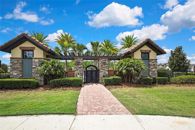 4155 Barletta Ct, Wesley Chapel, FL 33543 - view of front facade with stone siding, stucco siding, and a tiled roof