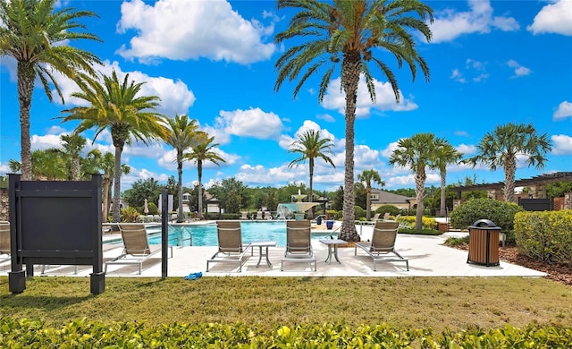 4155 Barletta Ct, Wesley Chapel, FL 33543 - community pool featuring a yard and a patio area