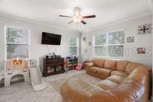 1395 White Fox Run, Lutz, FL 33549 - living area with ornamental molding and a ceiling fan