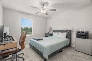 1395 White Fox Run, Lutz, FL 33549 - bedroom featuring a desk, baseboards, and light colored carpet