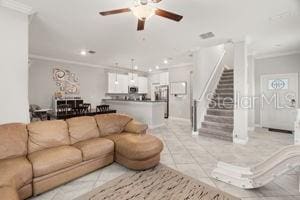 1395 White Fox Run, Lutz, FL 33549 - living area with crown molding, ceiling fan, stairs, light tile patterned flooring, and recessed lighting