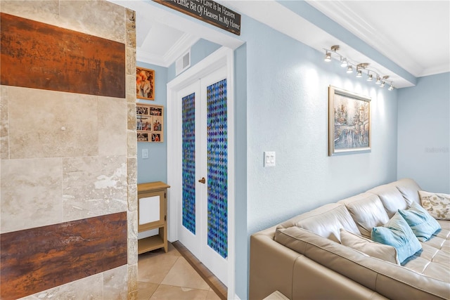 4900 Brittany Dr S Unit 611, Saint Petersburg, FL 33715 - living room with crown molding, light tile patterned flooring, and a textured wall