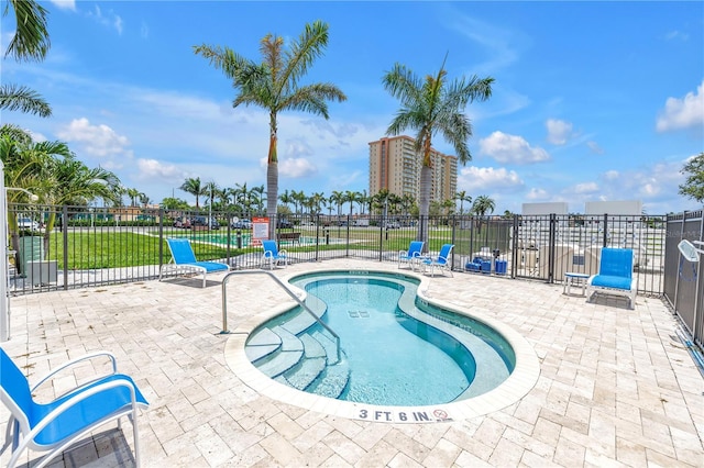 4900 Brittany Dr S Unit 611, Saint Petersburg, FL 33715 - view of pool with a swimming pool and a patio area