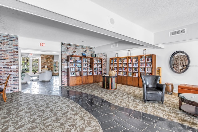 4900 Brittany Dr S Unit 611, Saint Petersburg, FL 33715 - living area featuring a textured ceiling