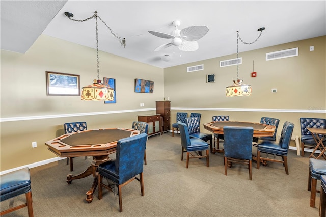 4900 Brittany Dr S Unit 611, Saint Petersburg, FL 33715 - carpeted dining room with ceiling fan and baseboards