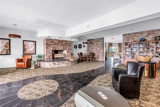 4900 Brittany Dr S Unit 611, Saint Petersburg, FL 33715 - living room featuring a textured ceiling and a fireplace