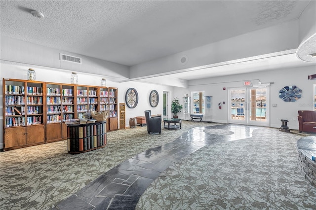 4900 Brittany Dr S Unit 611, Saint Petersburg, FL 33715 - common area with a textured ceiling