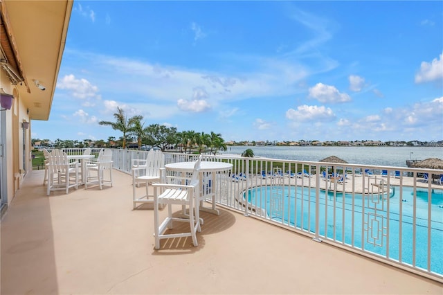 4900 Brittany Dr S Unit 611, Saint Petersburg, FL 33715 - community pool with a water view and a patio