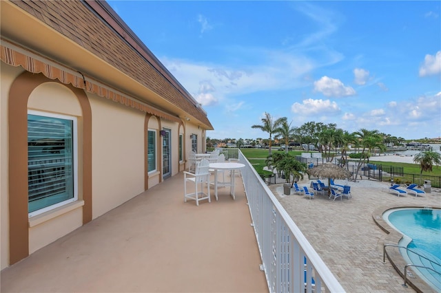 4900 Brittany Dr S Unit 611, Saint Petersburg, FL 33715 - balcony featuring view of pool area