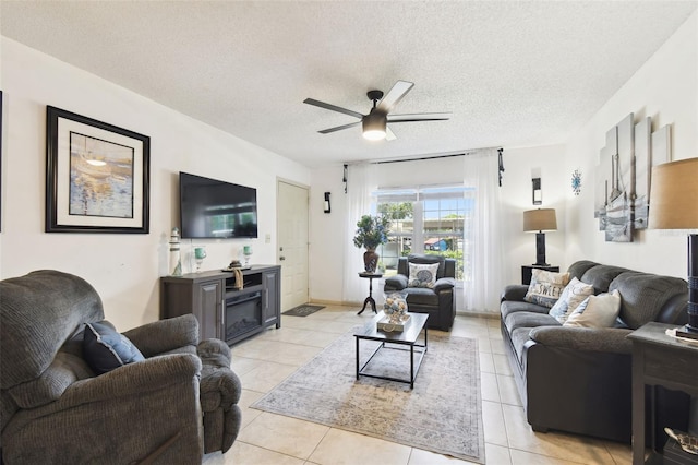 6630 Spring Flower Dr Unit 14, New Port Richey, FL 34653 - living room featuring a ceiling fan, light tile patterned floors, and a textured ceiling