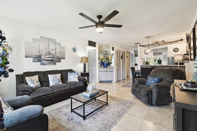 6630 Spring Flower Dr Unit 14, New Port Richey, FL 34653 - living area with ceiling fan, a textured ceiling, and light tile patterned floors