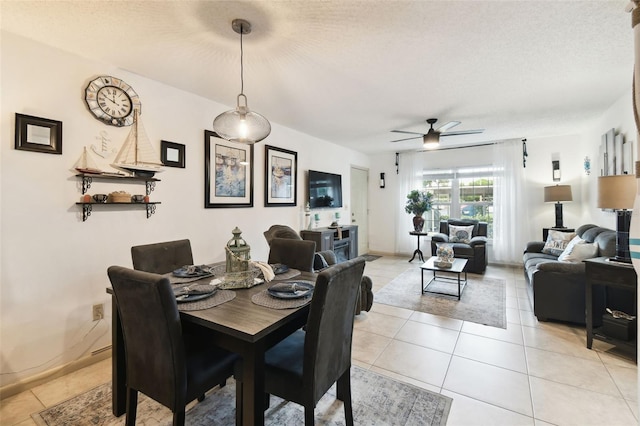 6630 Spring Flower Dr Unit 14, New Port Richey, FL 34653 - dining space featuring ceiling fan, light tile patterned floors, and a textured ceiling