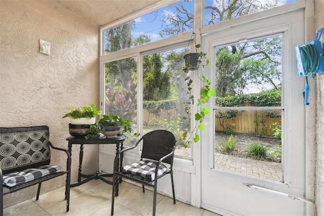 6630 Spring Flower Dr Unit 14, New Port Richey, FL 34653 - sunroom with tile patterned flooring and a textured wall