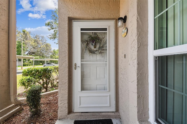 6630 Spring Flower Dr Unit 14, New Port Richey, FL 34653 - property entrance with stucco siding