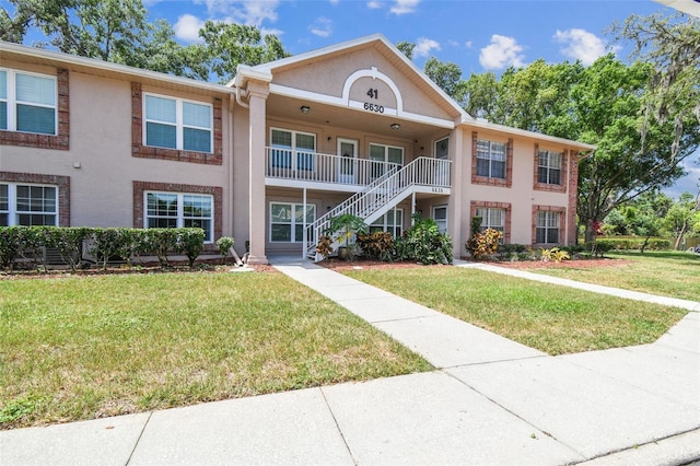 6630 Spring Flower Dr Unit 14, New Port Richey, FL 34653 - view of property featuring stairway