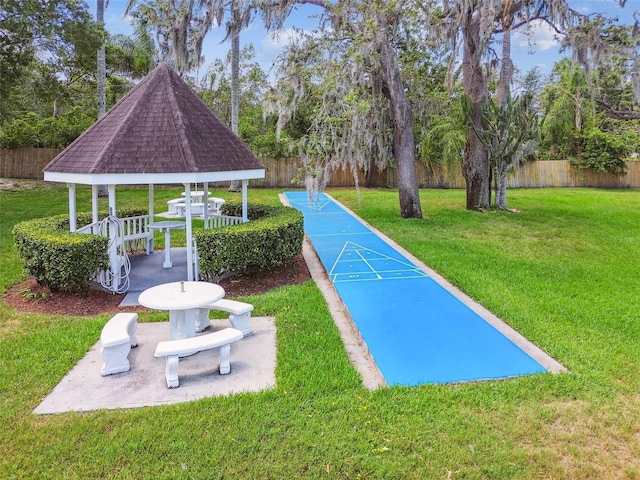 6630 Spring Flower Dr Unit 14, New Port Richey, FL 34653 - view of community featuring a gazebo, shuffleboard, and view of scattered trees