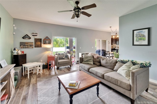 12316 Streambed Dr, Riverview, FL 33579 - living area with light wood-type flooring, a chandelier, and ceiling fan