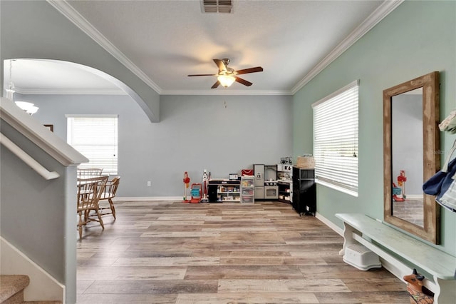 12316 Streambed Dr, Riverview, FL 33579 - game room with ceiling fan, arched walkways, plenty of natural light, crown molding, and wood finished floors