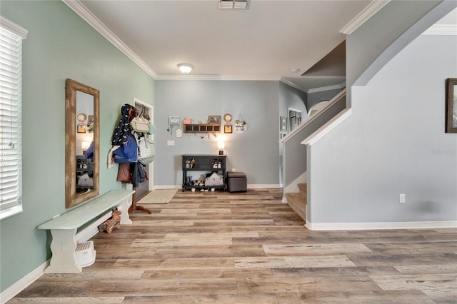 12316 Streambed Dr, Riverview, FL 33579 - foyer entrance featuring ornamental molding, wood finished floors, stairway, and baseboards