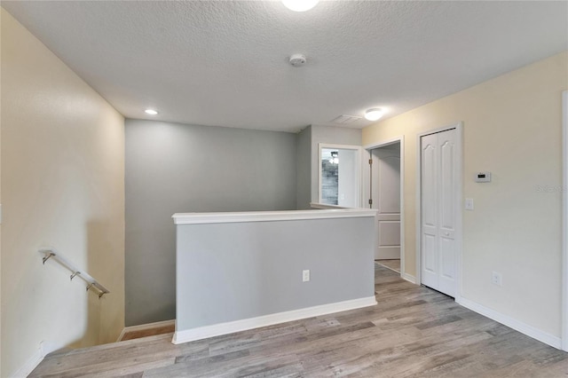 12316 Streambed Dr, Riverview, FL 33579 - empty room with a textured ceiling, wood finished floors, and baseboards