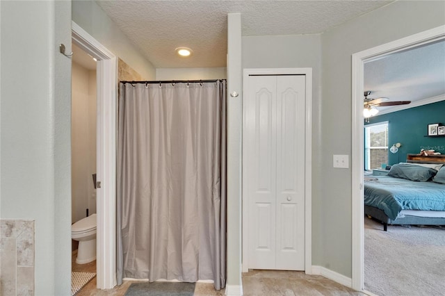 12316 Streambed Dr, Riverview, FL 33579 - ensuite bathroom featuring a closet, a textured ceiling, ceiling fan, toilet, and a shower with shower curtain