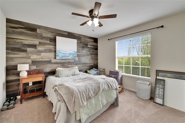 12316 Streambed Dr, Riverview, FL 33579 - carpeted bedroom featuring wood walls, an accent wall, baseboards, and a ceiling fan