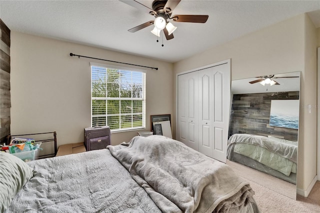 12316 Streambed Dr, Riverview, FL 33579 - bedroom with carpet flooring, wood walls, ceiling fan, and a closet