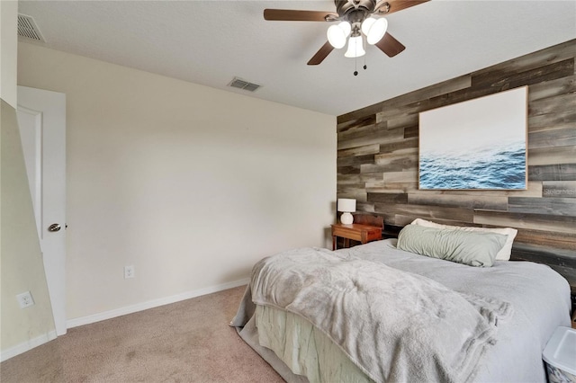 12316 Streambed Dr, Riverview, FL 33579 - bedroom featuring wood walls, carpet, baseboards, ceiling fan, and an accent wall