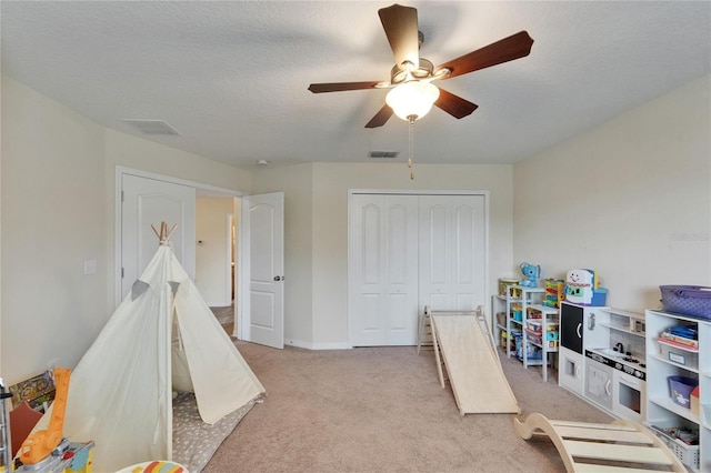 12316 Streambed Dr, Riverview, FL 33579 - game room featuring light carpet, a ceiling fan, a textured ceiling, and baseboards