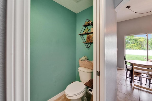 12316 Streambed Dr, Riverview, FL 33579 - bathroom featuring toilet, tile patterned floors, and baseboards