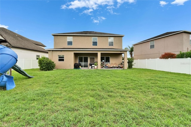 12316 Streambed Dr, Riverview, FL 33579 - rear view of property featuring stucco siding and a patio