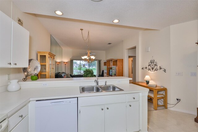 1012 Radison Lake Ct Unit 59, Sun City Center, FL 33573 - kitchen featuring white dishwasher, a sink, a peninsula, light countertops, and recessed lighting