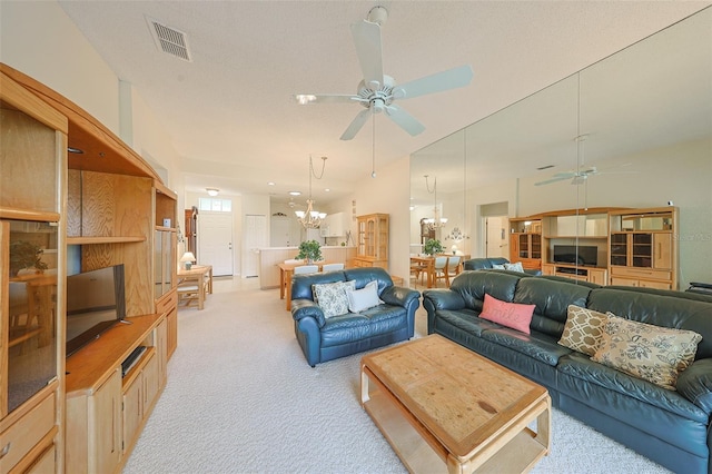 1012 Radison Lake Ct Unit 59, Sun City Center, FL 33573 - living room featuring a ceiling fan, light colored carpet, and a chandelier