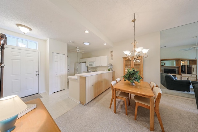 1012 Radison Lake Ct Unit 59, Sun City Center, FL 33573 - dining area featuring a ceiling fan, a chandelier, recessed lighting, baseboards, and light colored carpet